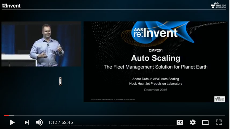 Screenshot from a video of the AWS re:Invent 2016 presentation on Auto Scaling titled 'The Fleet Management Solution for Planet Earth,' featuring a presenter and a slide with session details.