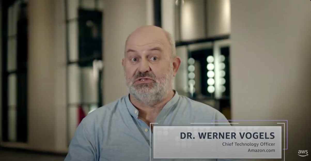Thumbnail image featuring Dr. Werner Vogels, Chief Technology Officer of Amazon.com, in Milan. The image shows him speaking indoors with a blurred background and an overlay displaying his name and title.
