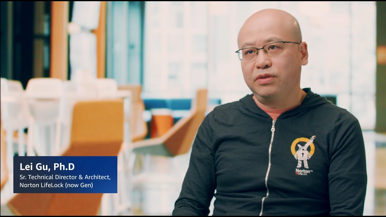 YouTube video thumbnail showing Lei Gu, Ph.D., Sr. Technical Director & Architect at Norton LifeLock (now Gen), seated in a modern office setting during an interview.