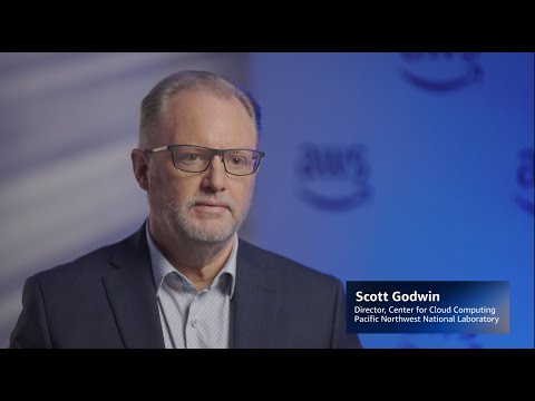 Scott Godwin's title and affiliation displayed on a blue background: "Director, Center for Cloud Computing, Pacific Northwest National Laboratory."