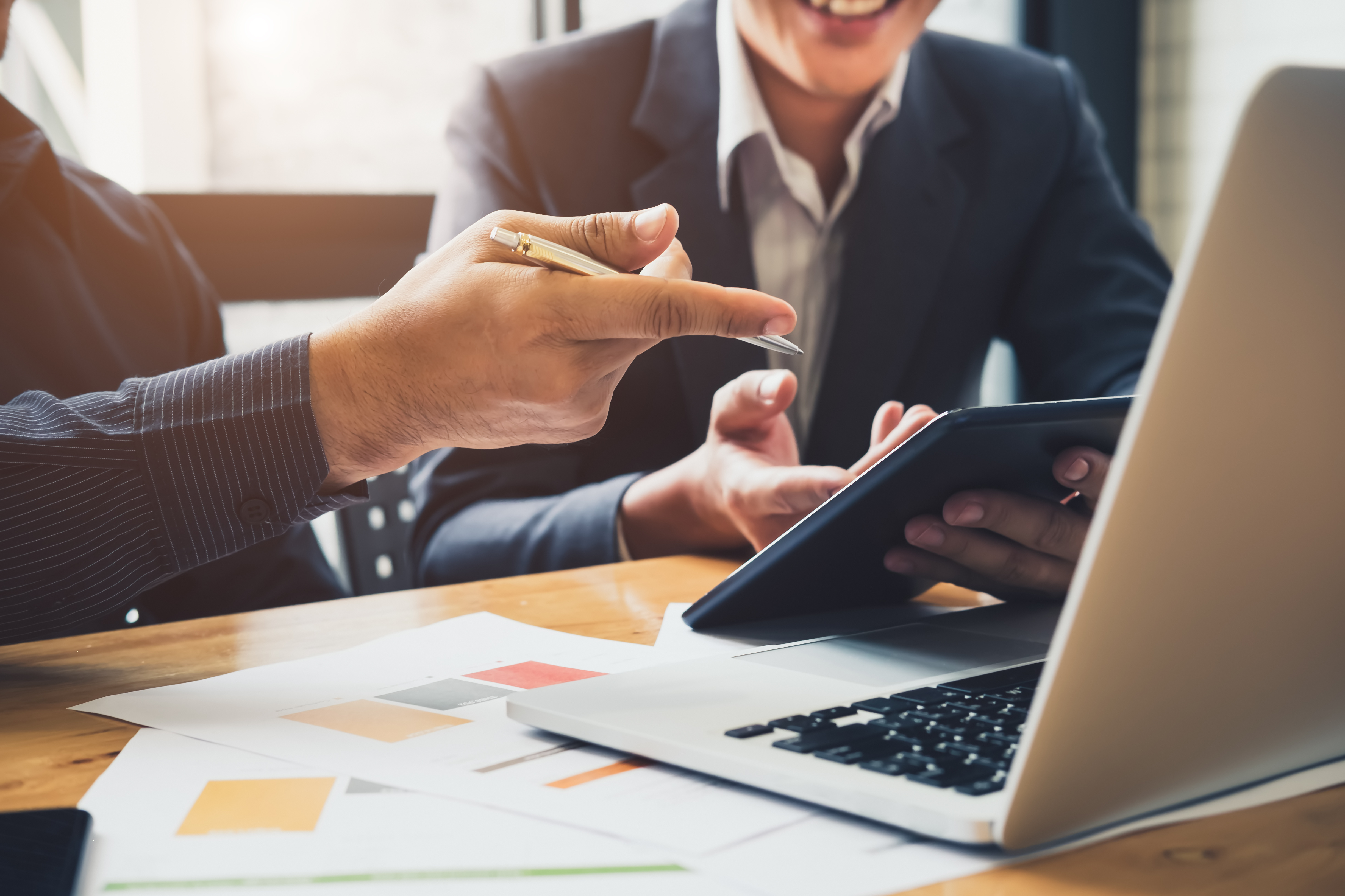 Asian business adviser meeting to analyze and discuss the situation on the financial report in the meeting room.Investment Consultant,Financial Consultant,Financial advisor and accounting concept