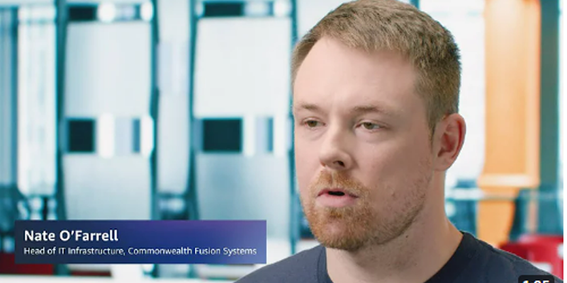 Nate O'Farrell, Head of IT Infrastructure at Commonwealth Fusion Systems, speaks in an interview with an office environment background.