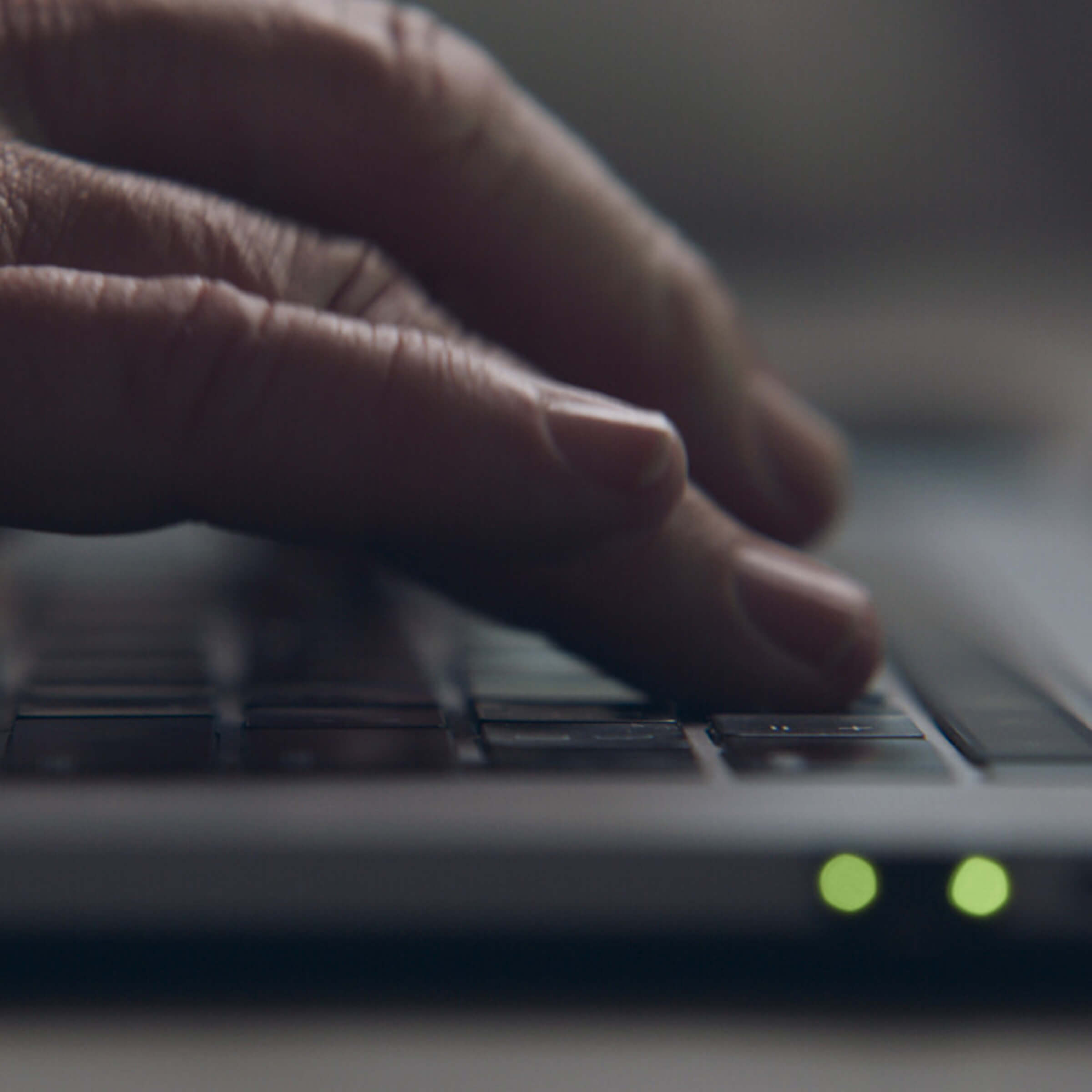 Close up of fingers typing on keyboard