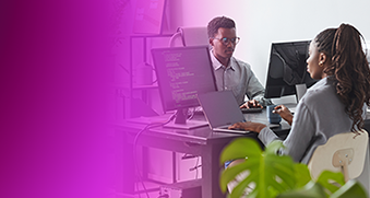 Two professionals working at computers in a modern office environment, highlighting collaboration and digital transformation, with a magenta overlay on the left.