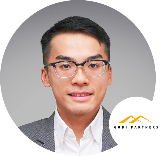 Professional headshot of an individual wearing glasses in business attire, featuring the Gobi Partners logo in the corner.