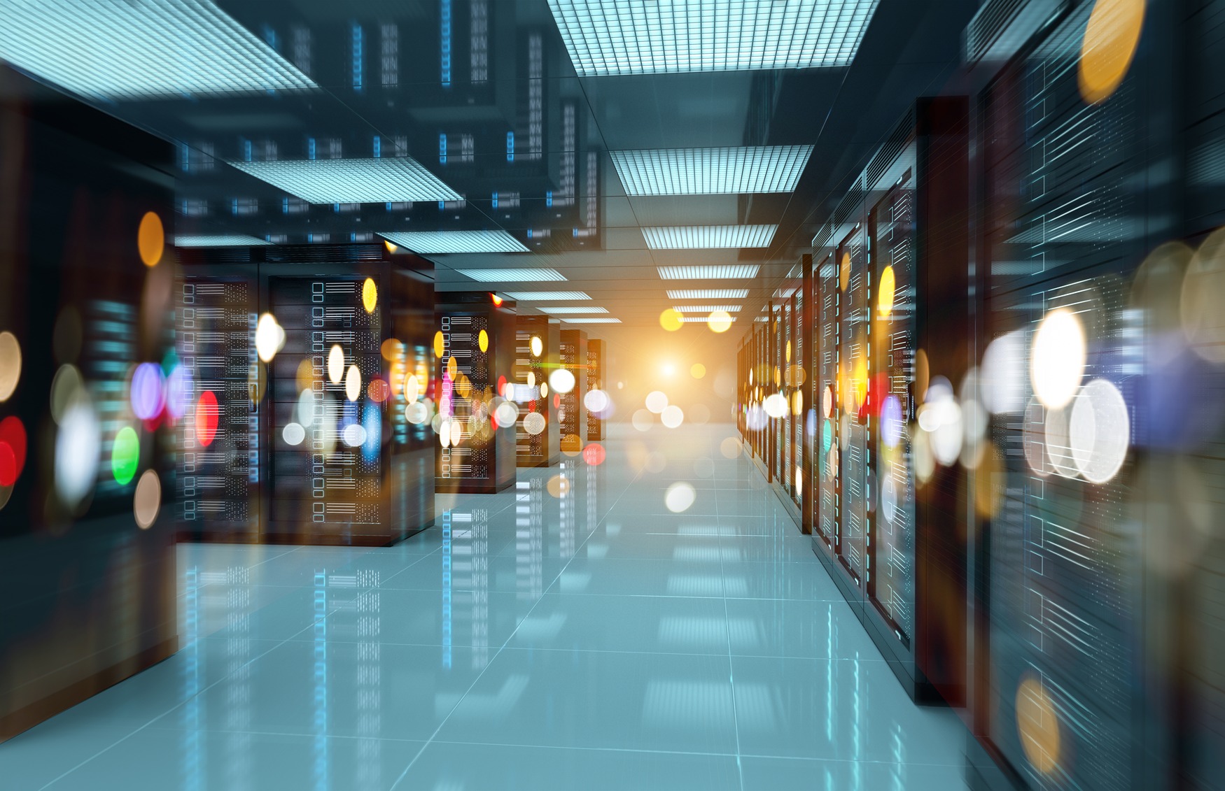 A modern data center server room featuring rows of server racks and blurred colorful lights, representing advanced technology and digital infrastructure.
