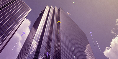 A conceptual image of skyscrapers with upward arrows, symbolizing financial growth and investment.