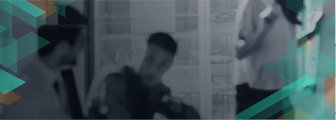 A blurred grayscale image of a business meeting scene with people, overlaid with abstract green and teal geometric shapes. Modern, corporate style background.