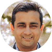 Headshot of a guest podcast speaker, circular crop, outdoors with a soft background.