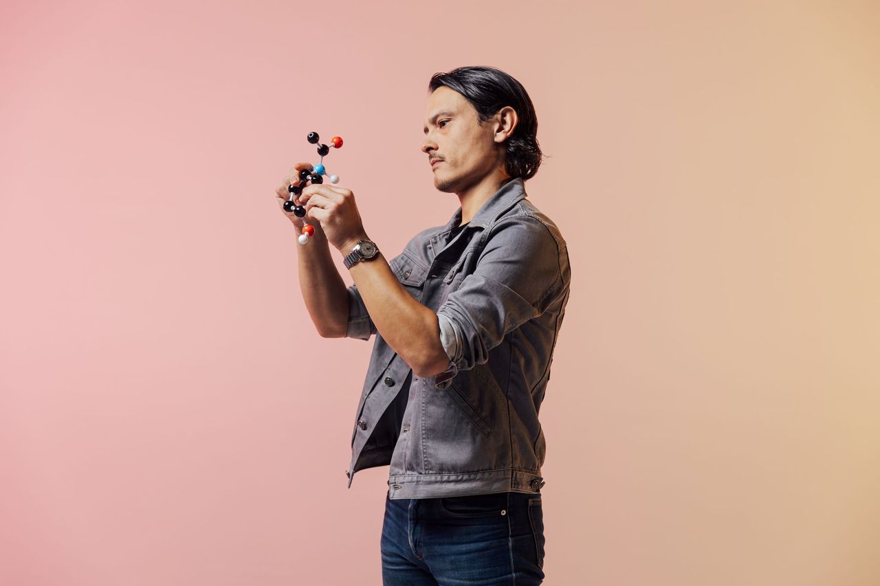 Man looking at scientific model