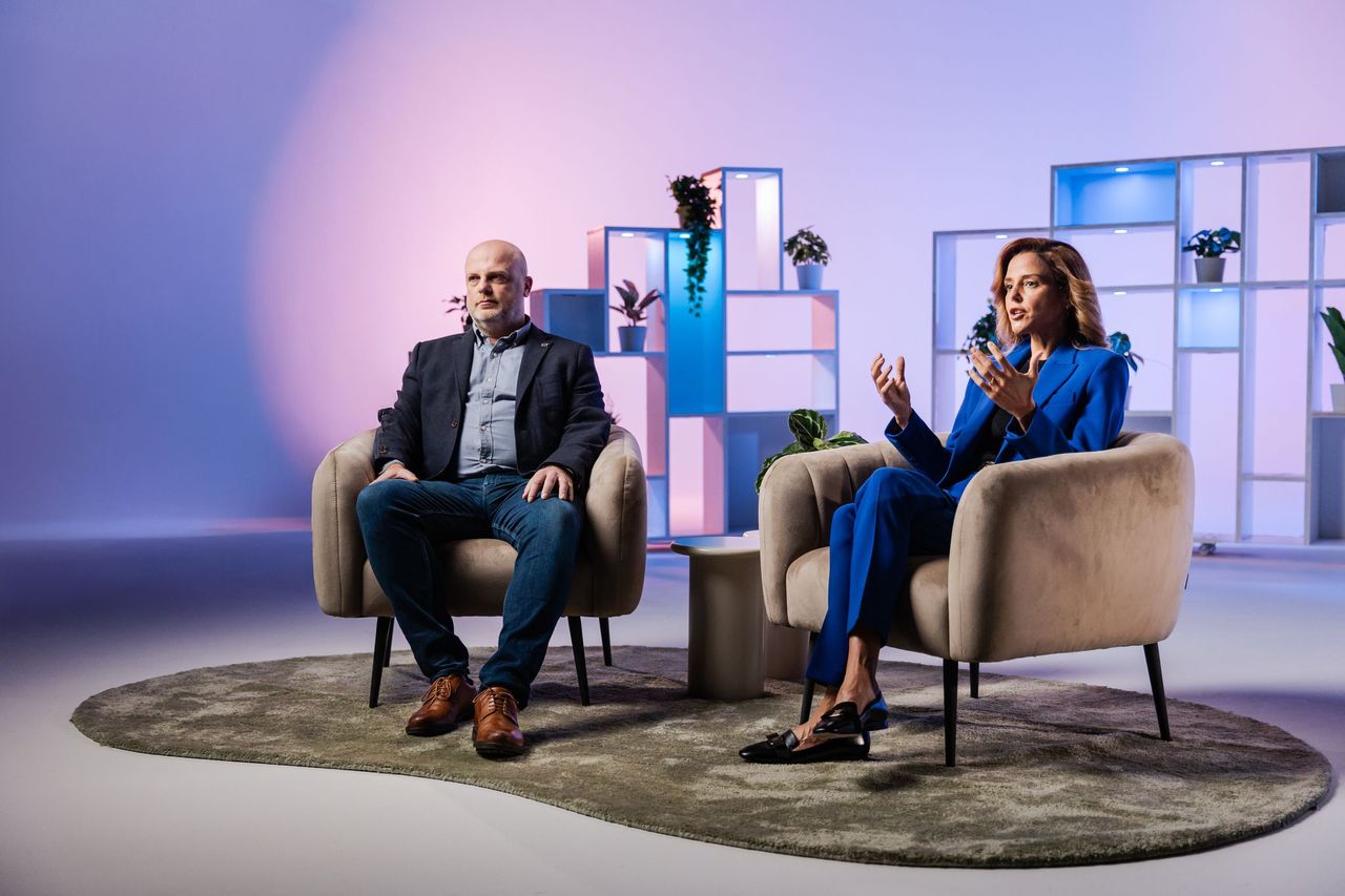 man and women being interviewed