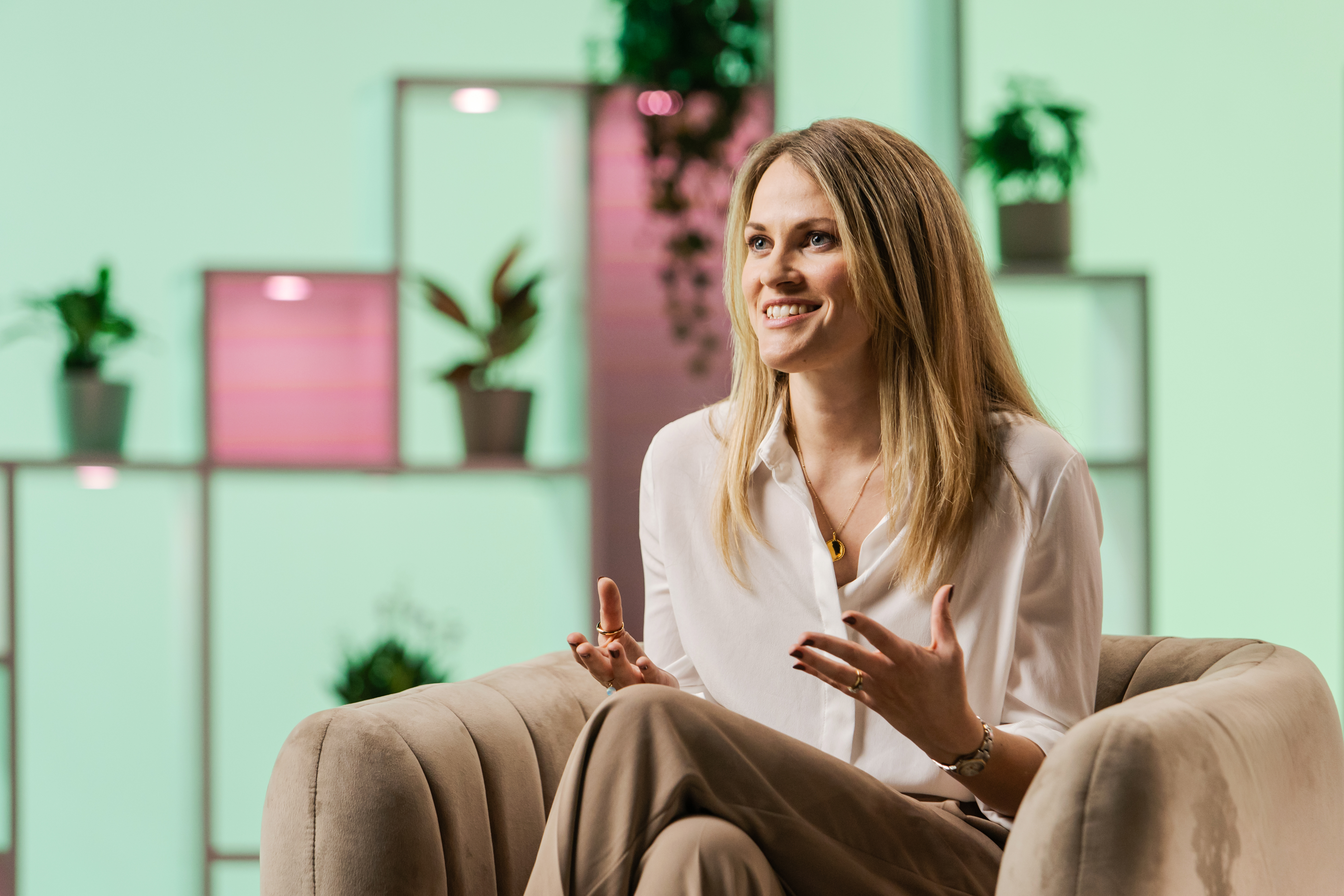 woman sitting in chair being interviewed