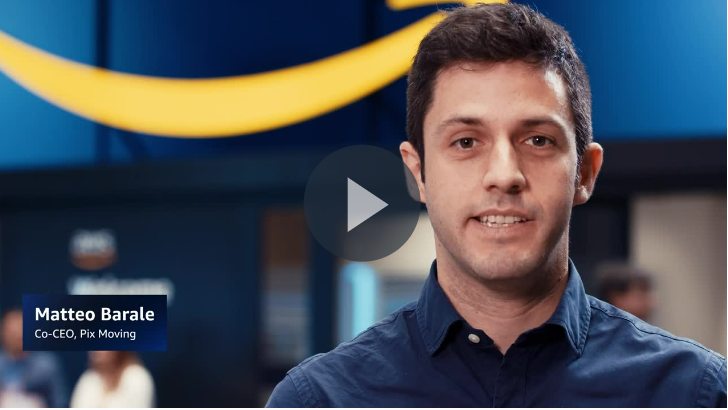 Matteo Barale, Co-CEO of Pix Moving, at an event discussing AI generative design in automotive manufacturing. He is seen speaking in front of a backdrop with the AWS logo, representing innovation in artificial intelligence and manufacturing.