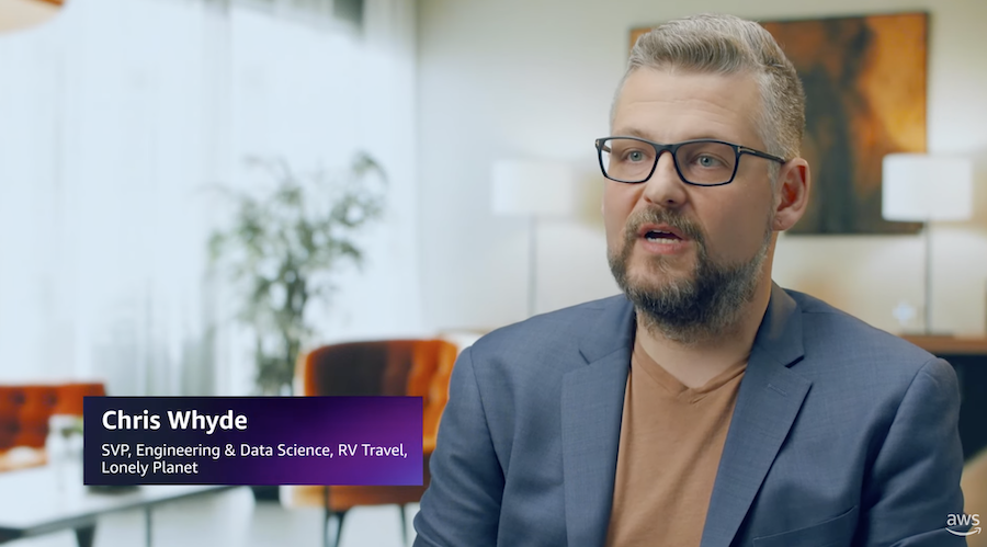 Chris Whyde, SVP of Engineering & Data Science at Lonely Planet, provides a testimonial about AWS in a professional office setting.
