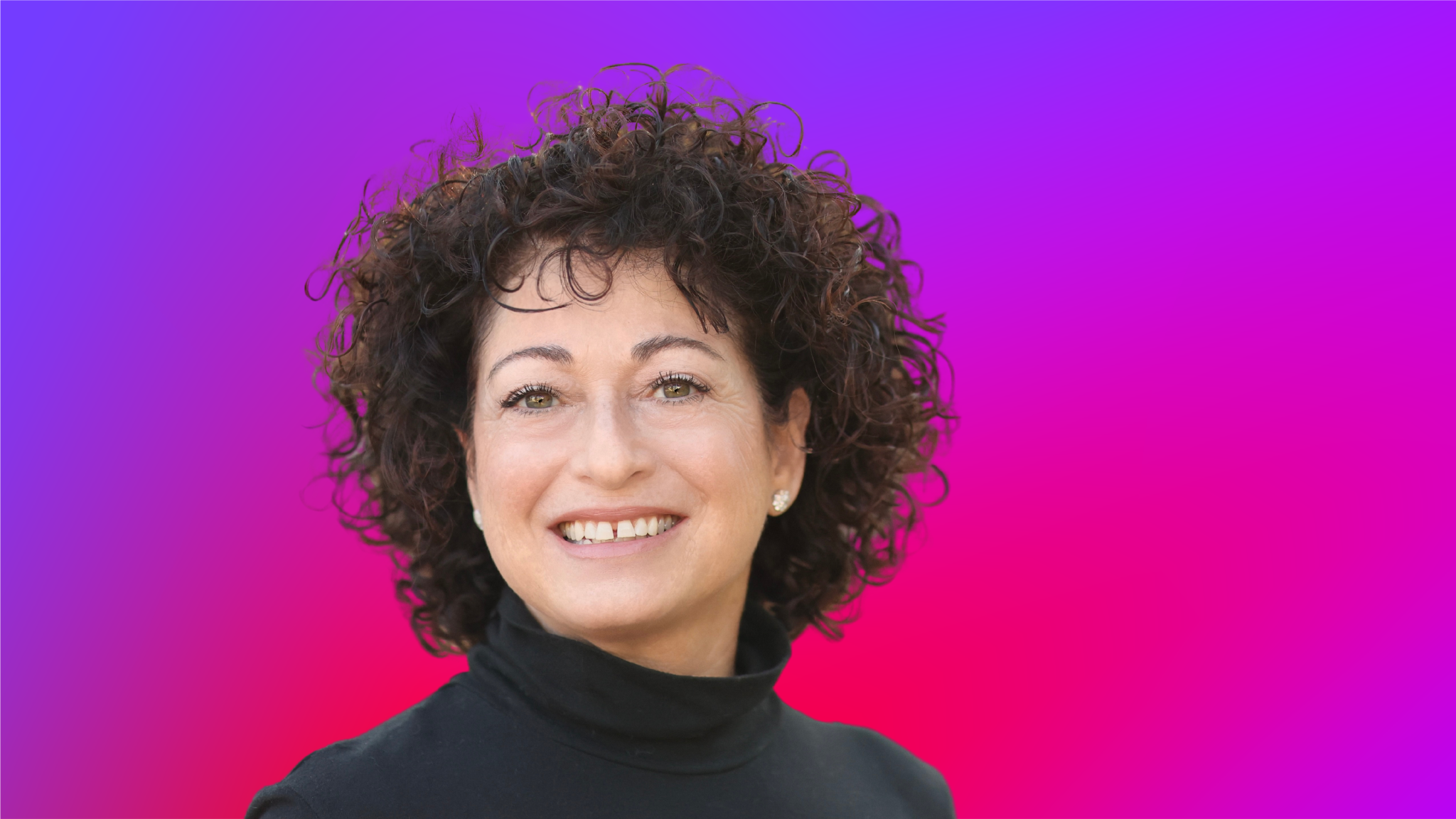 A person with curly dark hair wearing a black turtleneck, set against a vibrant gradient background of purple and pink.