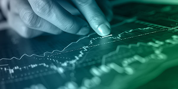 A close-up image of a hand interacting with a digital touchscreen displaying analytic data visualizations and graphs, symbolizing AI, machine learning, and artificial intelligence analysis.