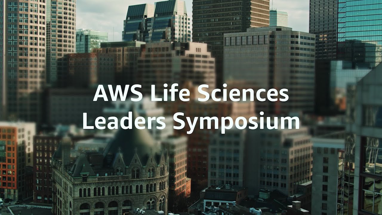 "Text reading 'AWS Life Sciences Leaders Symposium' over a cityscape with modern and historic buildings."