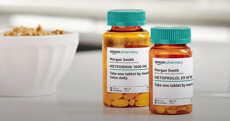 Two prescription medication bottles labeled Amazon Pharmacy are shown on a table, filled with tablets and labeled for patient Morgan Smith. A bowl with food is visible in the background.