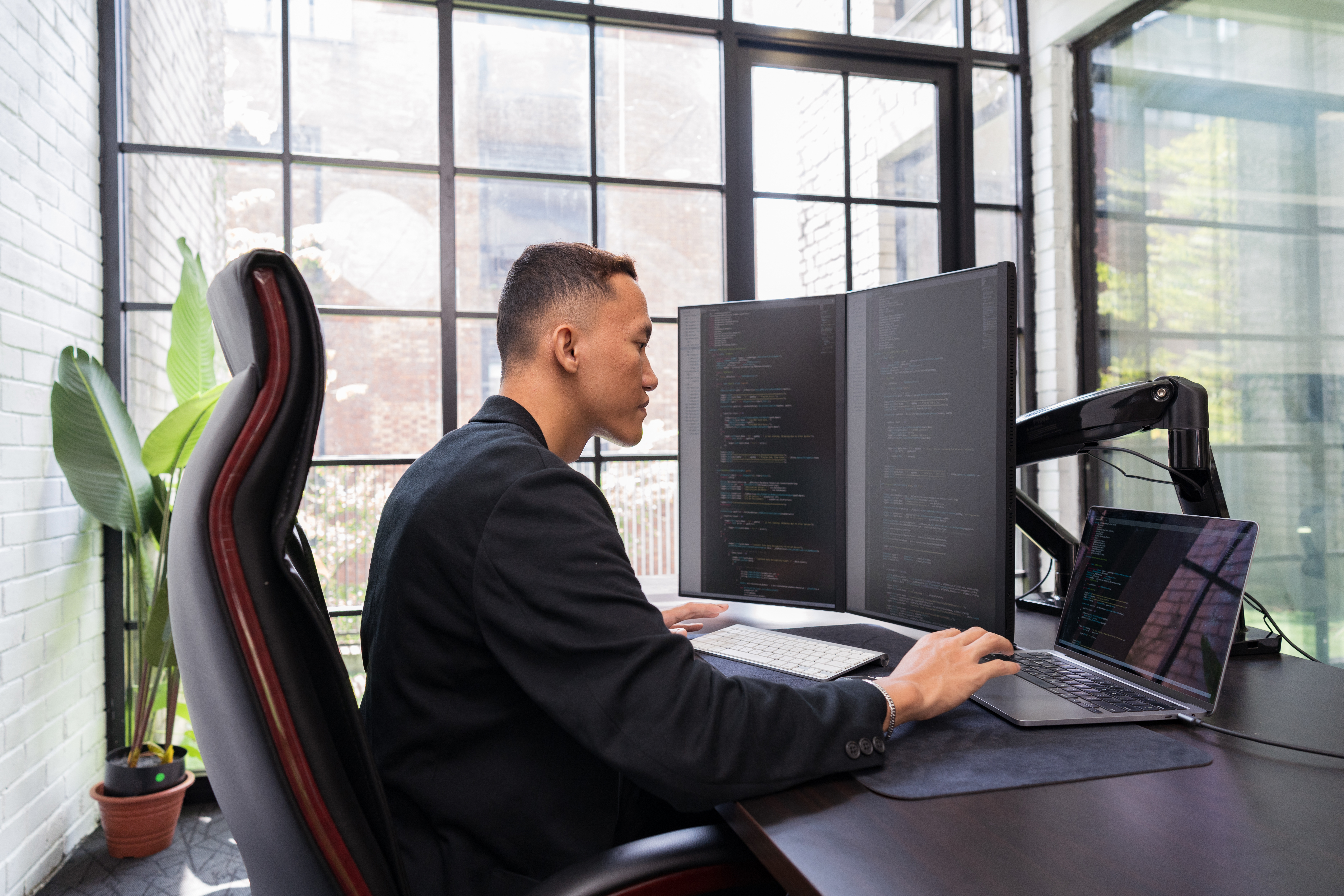 Colleagues working with device and collaborating at office