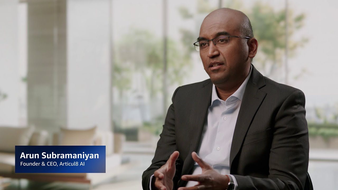 YouTube thumbnail image featuring an executive in a business suit, labeled as Arun Subramaniyan, Founder & CEO of Articul8 AI, speaking in an interview setting with a blurred office background.