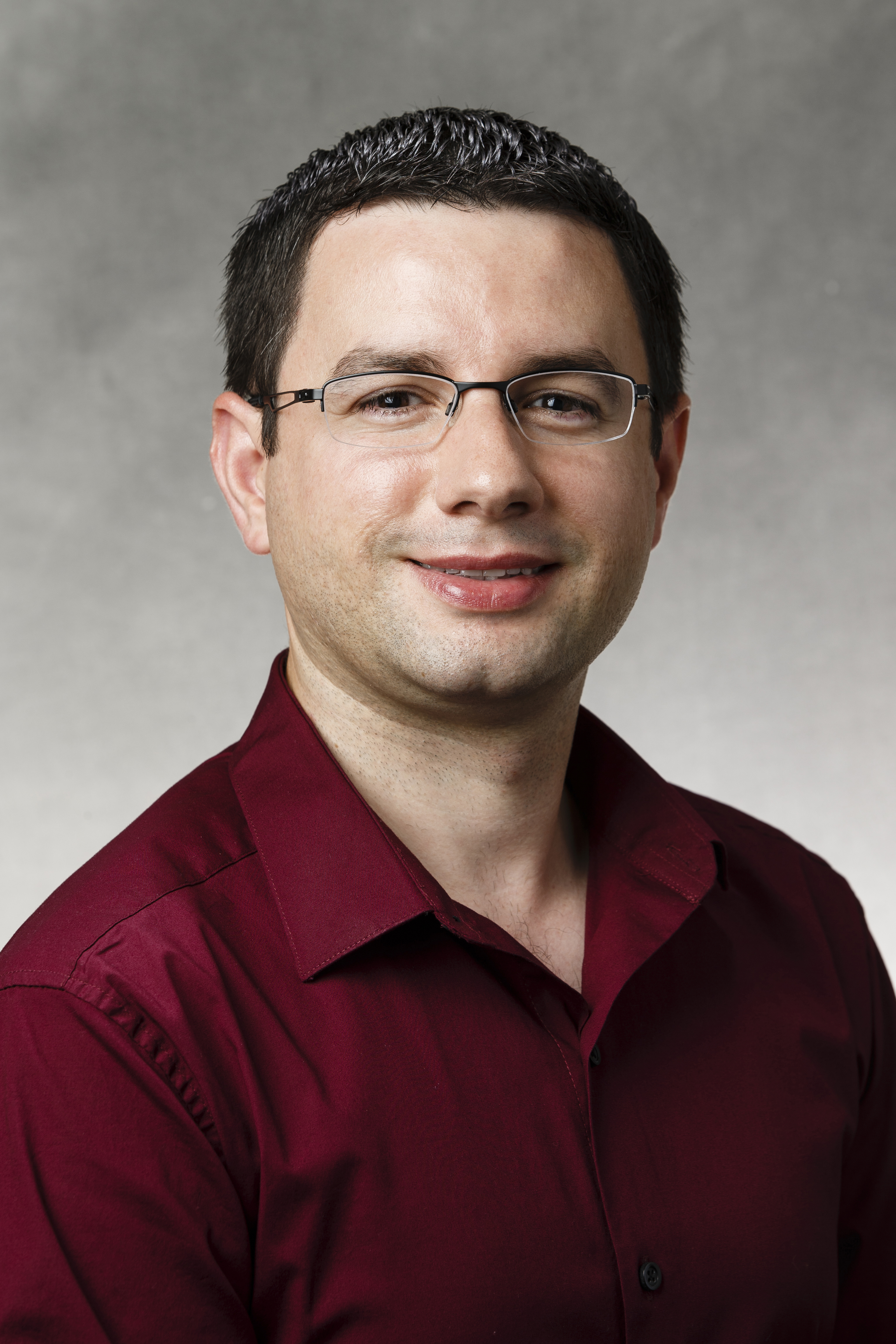 Studio portrait of Julian Mino, web application developer in IRT, taken on October 6, 2015.