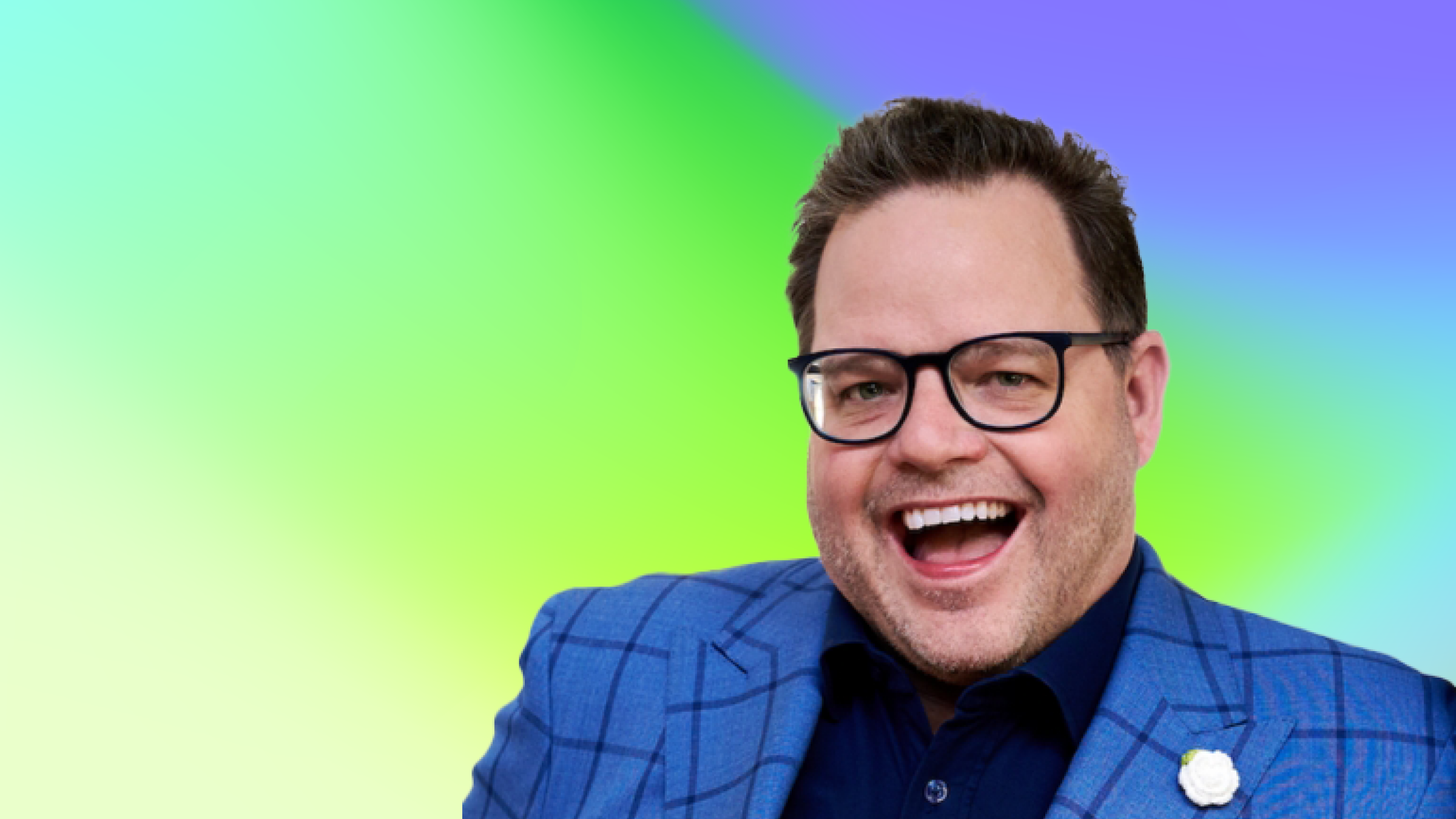 A person wearing a blue checkered suit jacket with a white flower lapel pin, set against a gradient background of green, blue, and purple.