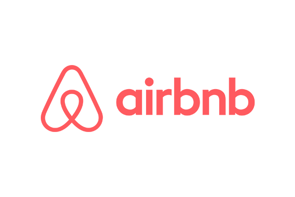 Airbnb logo in red, featuring a stylized "A" symbol and the brand name.