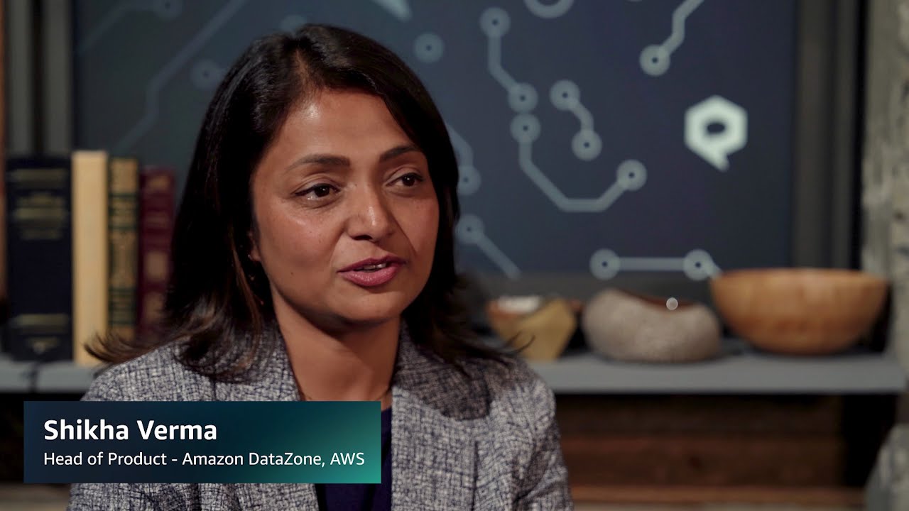 A YouTube video thumbnail featuring the Head of Product for Amazon DataZone at AWS, set in a professional interview environment with books and decor in the background.