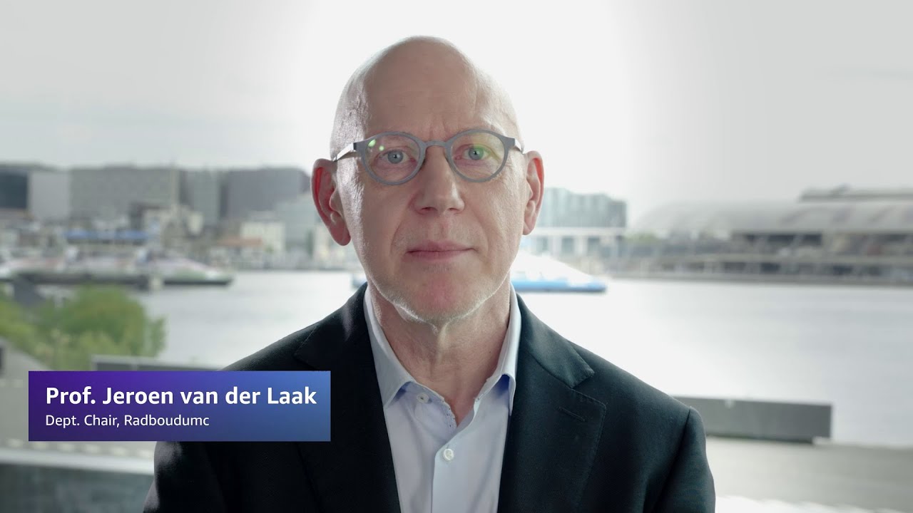Text overlay reads "Prof. Jeroen van der Laak, Dept. Chair, Radboudumc" with a waterfront cityscape in the background.