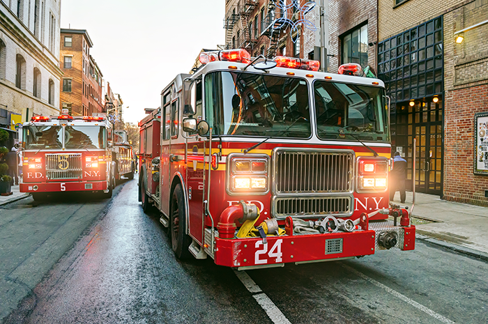 Fire engines driving on the streets of Manhattan, New York