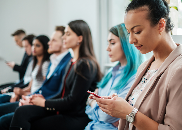 Group of young people waiting for a job interview.