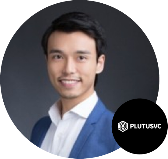Professional business portrait of a man in a blue suit and white shirt, smiling at the camera, with a dark background and the PlutusVC logo visible in the lower right corner.
