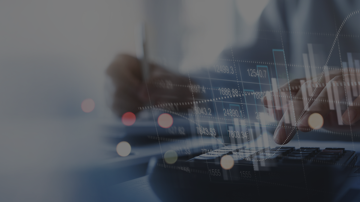 Hands using a calculator with financial graphs and data overlays, representing financial data analysis and cloud financial management.