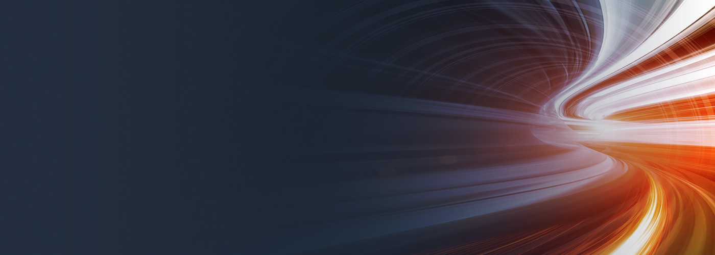 An abstract image featuring dynamic light trails in orange and white against a dark background, symbolizing speed and computational power.