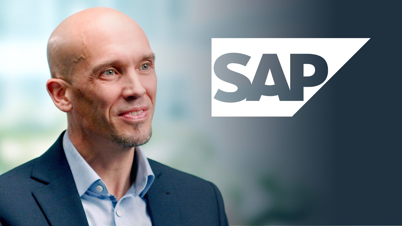 YouTube thumbnail image featuring a business professional in a suit and the SAP logo, intended for an interview or business-related content.
