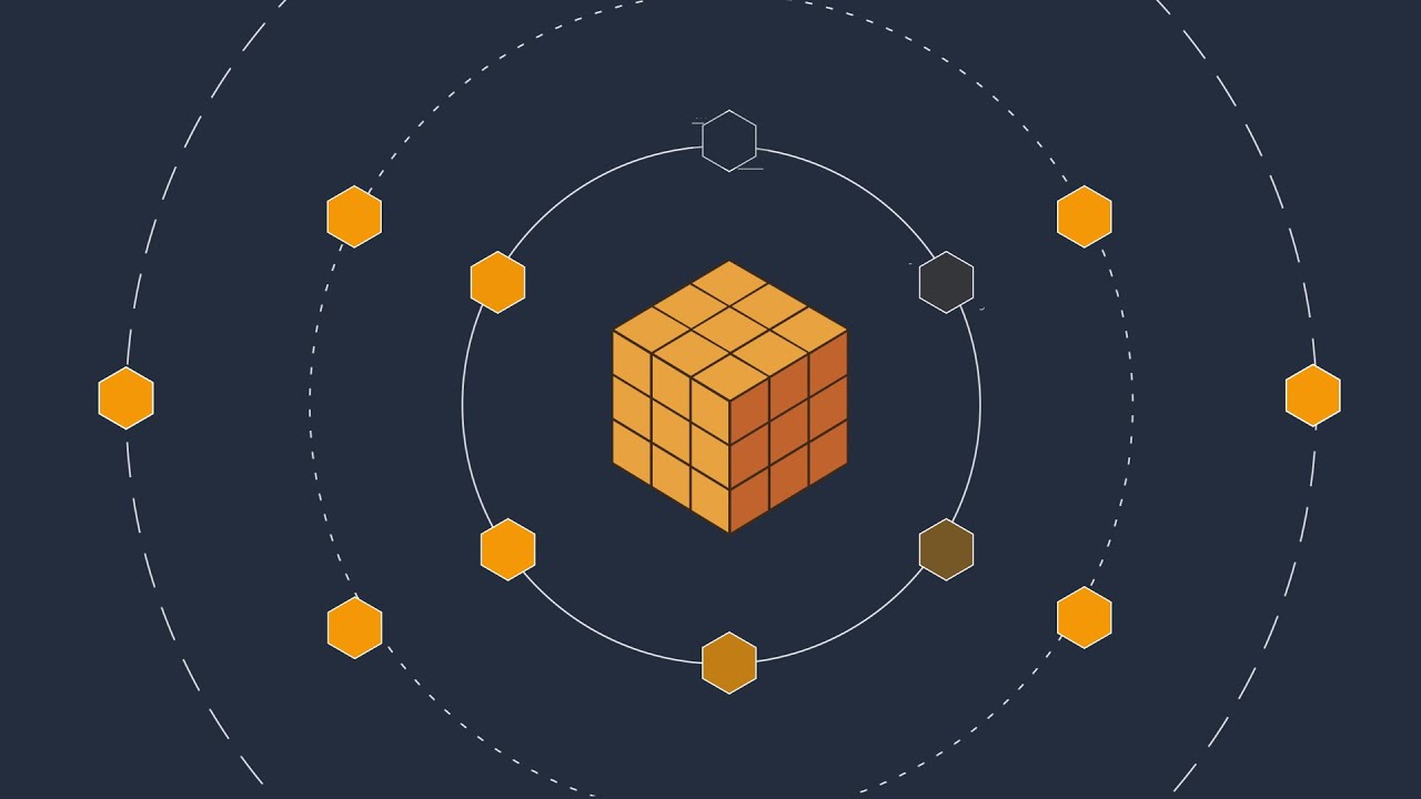 Illustration of an orange 3D cube in the center with multiple orange and gray hexagons surrounding it, connected by circular dashed lines on a dark background, representing a network or distributed computing concept.