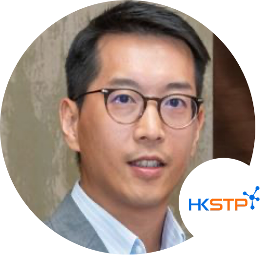 Portrait of a male professional wearing glasses and a suit, with the HKSTP logo in the lower right corner.