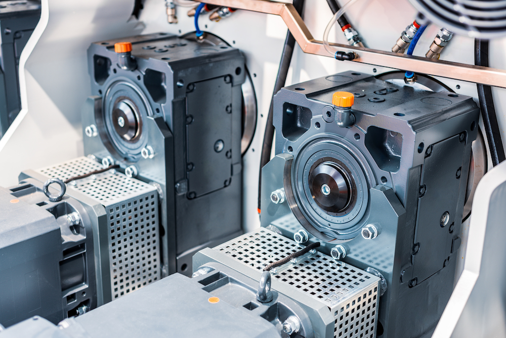 Modern powerful electric motors-reducers. Abstract industrial background.