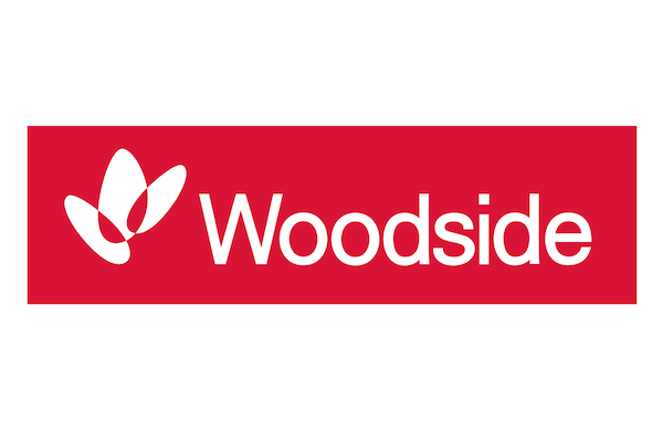 Woodside company logo displayed in white on a red rectangular background.