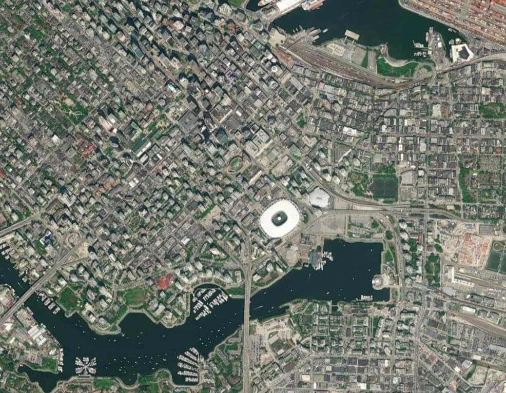A satelite view of large coastal city 