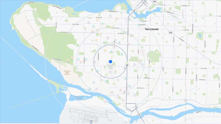 A map of Vancouver, Canada with a location marker surrounded by a wide circle. There are location pins indicating locations found nearby the location marker