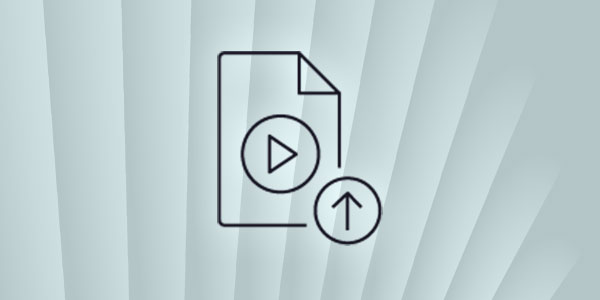 Line art icon of a document with a play button and an upward arrow, representing video or media file upload or ingest, on a light abstract background.