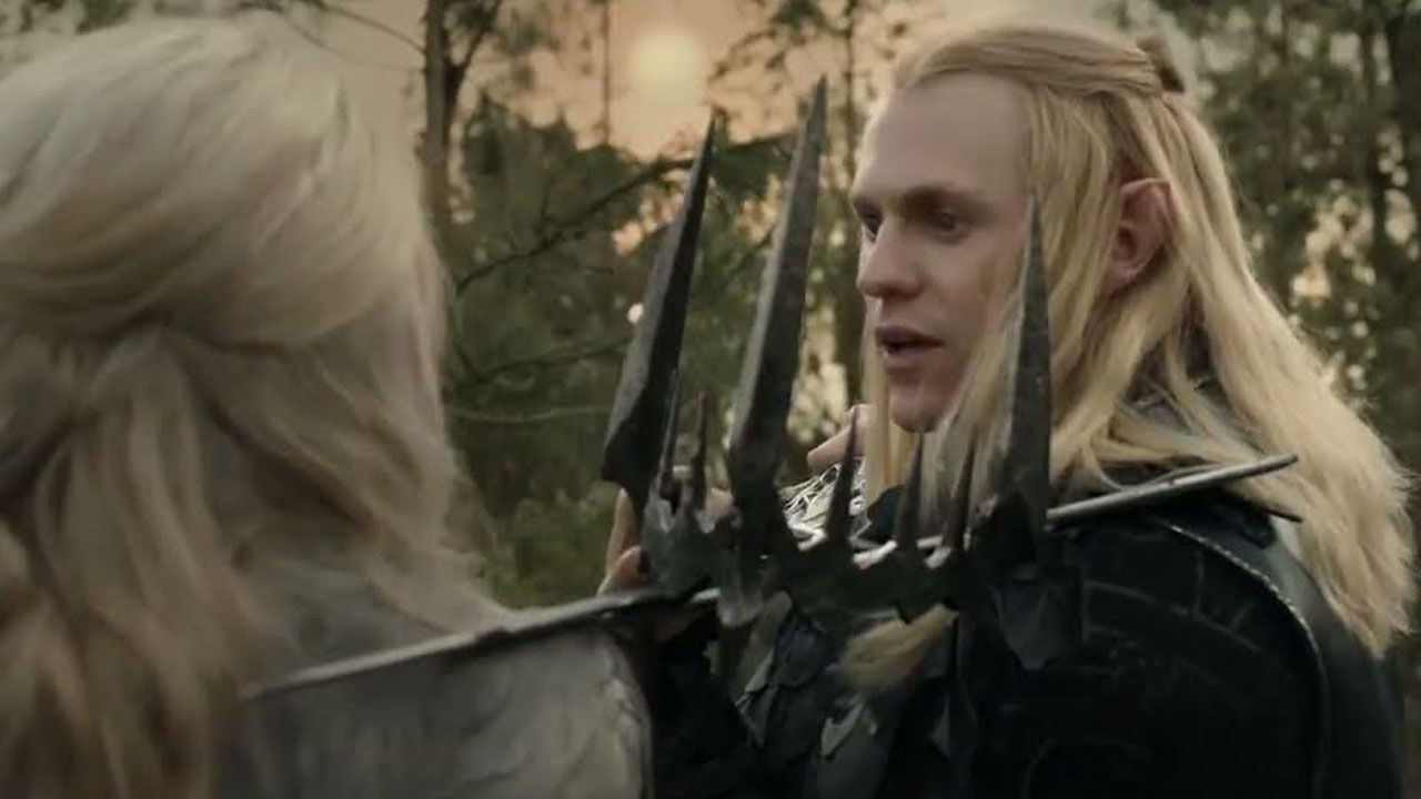 A blonde-haired character in armor holding a spiked weapon in a forest at sunset.