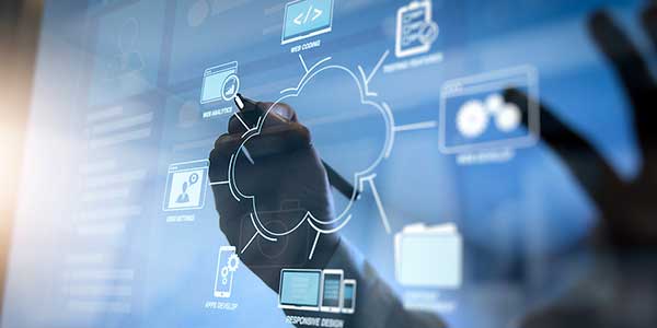 A person interacts with a digital interface displaying a cloud networking diagram, showing interconnected technology icons representing cloud computing, application development, and data integration.