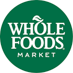 Whole Foods Market logo in white text on a green circular background.
