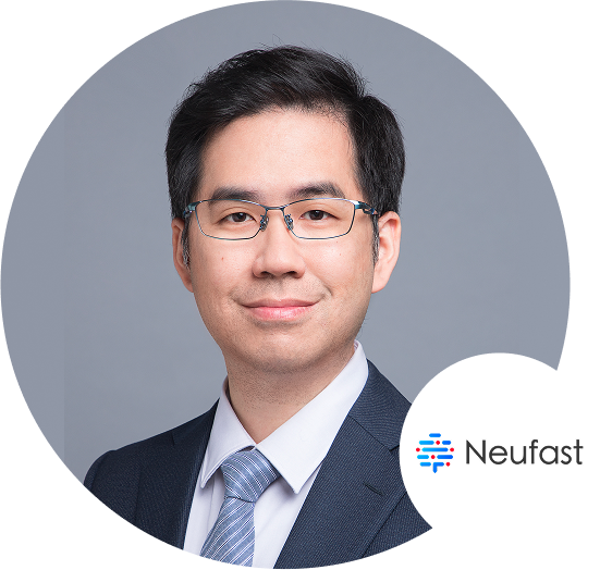 A professional headshot of a man wearing a suit and glasses, with the Neufast logo visible in the lower right corner.