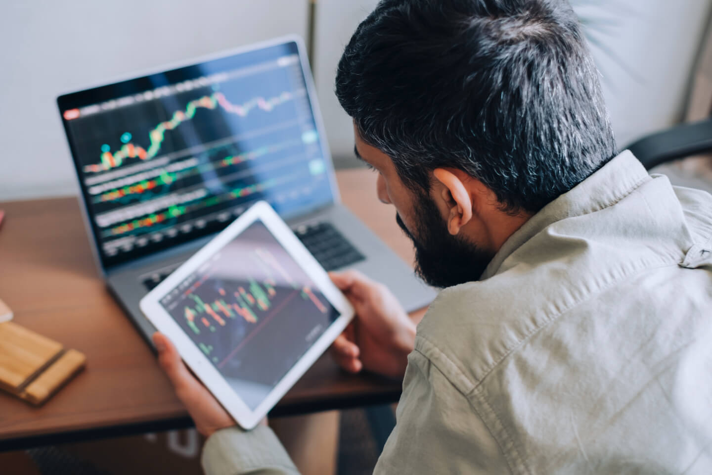 Business leader analyzing financial progress chart on tablet