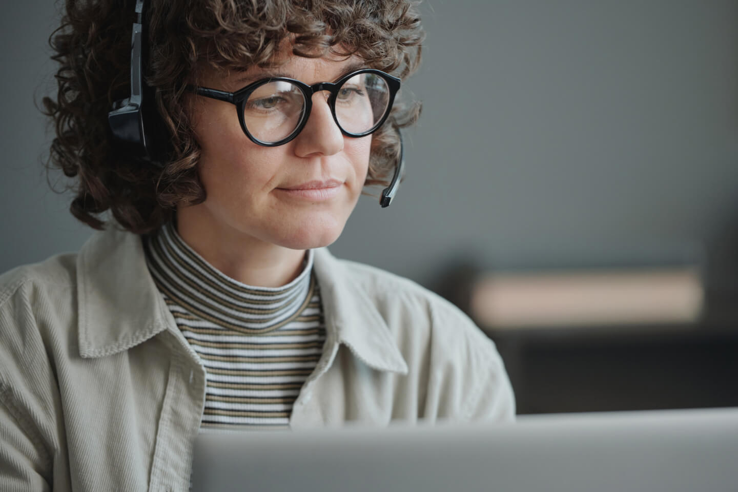 Female contact center call handler wearing headset