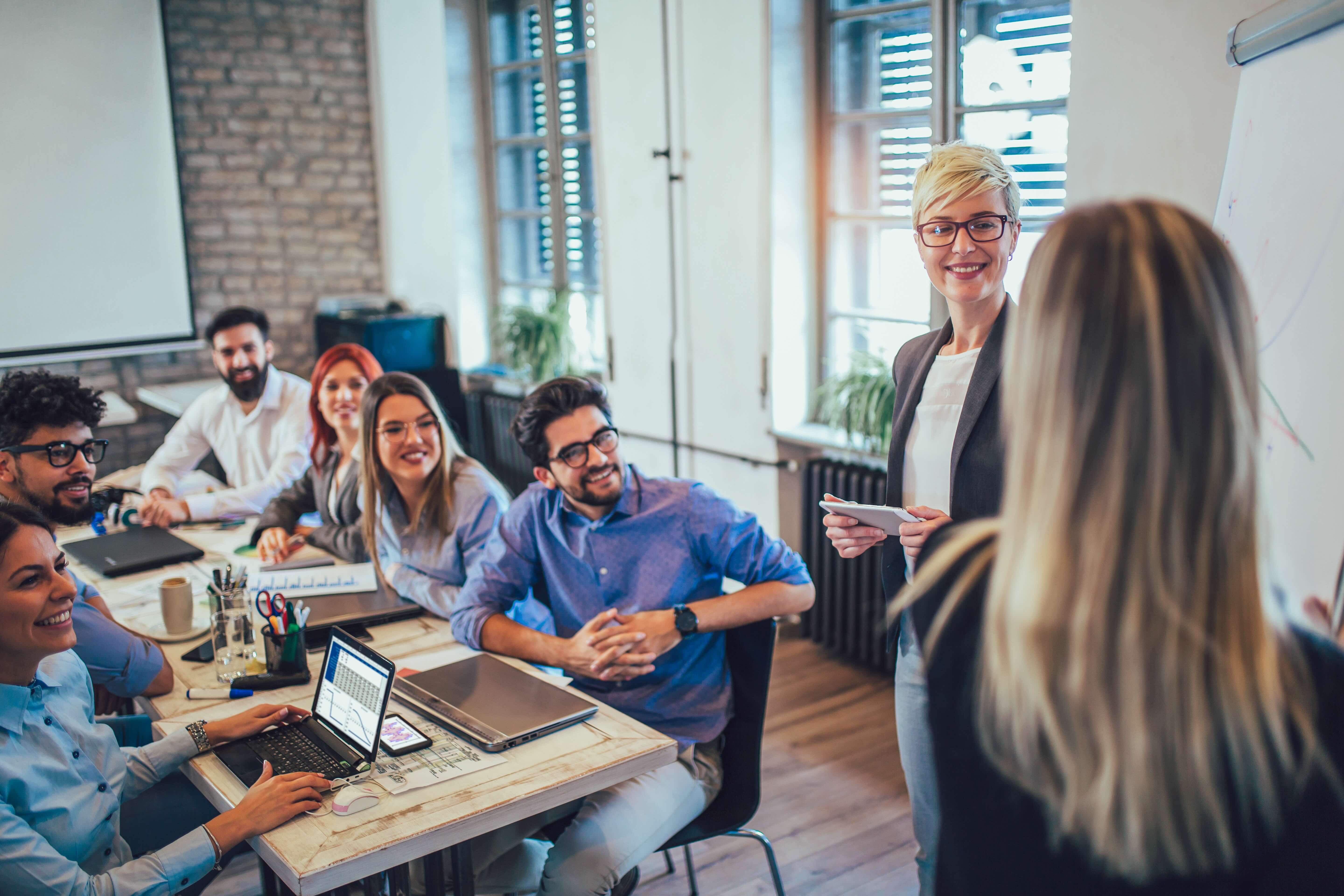 Business colleagues in conference meeting room during presentation