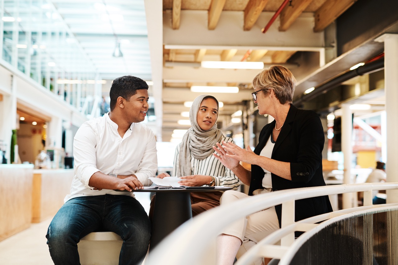 Shot of a group of business people having a discussion in an office